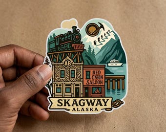 May include: A die-cut sticker featuring a steam train on a trestle bridge above the Red Onion Saloon building in Skagway, Alaska. The design includes snow-capped mountains, hikers, a cruise ship, and the text Skagway Alaska in a banner.