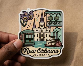 May include: A die-cut sticker featuring a New Orleans, Louisiana illustration. The design includes a purple Mardi Gras mask, a green St. Charles streetcar, a cathedral, a paddlewheel boat, and a balcony. The text reads New Orleans Louisiana.