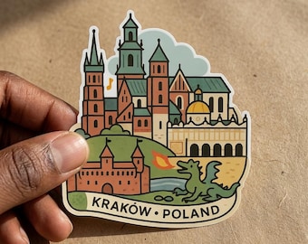 May include: A die-cut sticker featuring a colorful illustration of the Wawel Castle and Cathedral in Krakow, Poland. The design includes a green dragon breathing fire, a small musical note, and the text KRAKÓW • POLAND at the bottom.