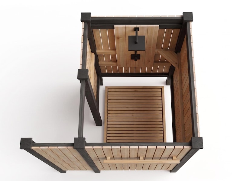 May include: An outdoor shower enclosure featuring natural light-colored wood vertical slats framed by dark charcoal-colored posts. The unit includes a square black shower head mounted on a central panel and a slatted wood floor base for drainage.