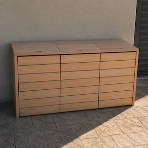 May include: A rectangular outdoor storage unit constructed from light brown horizontal wooden slats. The unit features three separate hinged lids on top, each with a small recessed handle, and a front panel divided into three vertical sections.