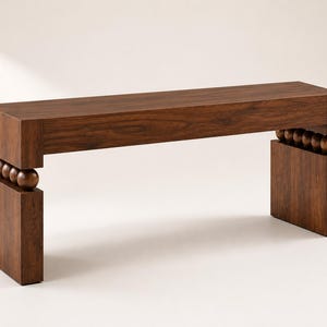 May include: A dark brown wooden bench featuring a rectangular seat and two solid rectangular legs. The seat is connected to each leg by a row of four spherical wooden beads, creating a distinct gap between the top and the base structure.
