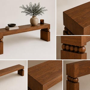 May include: A rectangular wooden bench featuring a thick, flat top surface and two sturdy legs. Each leg is connected to the bench top by a row of four spherical wooden balls. The wood has a visible grain pattern in a medium brown tone.
