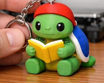Llavero de tortuga Sky Crafter: abalorio artesanal único multicolor impreso en 3D y pintado a mano.