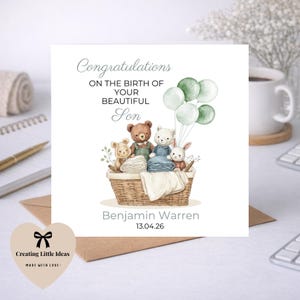 May include: A square greeting card with the words "Congratulations on the birth of your beautiful son." The card shows a watercolour illustration of stuffed animals in a basket with balloons. The card is personalised with the name "Benjamin Warren" and the date "13.04.26".