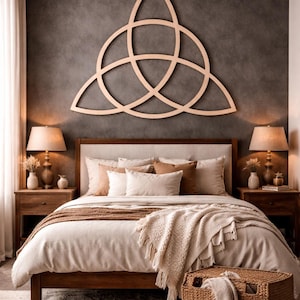 May include: A bedroom with a wooden bed, headboard, and a large wooden wall art piece. The bed has neutral-toned bedding and pillows. Two lamps sit on bedside tables. A woven basket and rug complete the room, creating a warm atmosphere.