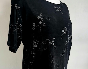 Vintage zwarte heksentop uit de jaren 80 met zilveren glitters en schoudervullingen