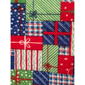 May include: A fabric pattern featuring a collage of rectangular gift boxes in red, green, and blue. The boxes are decorated with various prints including white polka dots, red and blue plaid, green diagonal stripes, and red vertical lines.