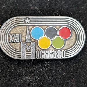 Badge épingle logo tour anneaux Jeux Olympiques d