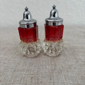 May include: A rustic wooden sign with the text "Welcome to our home" in white lettering. The sign features a distressed finish and a simple, inviting design, perfect for a front porch or entryway.