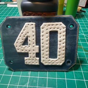 May include: A set of three ceramic mugs with a speckled, matte finish. The mugs are in shades of cream, light gray, and dark gray. Each mug has a simple, minimalist design and a rounded handle.