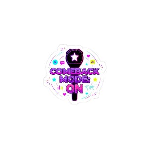 May include: A sticker with a microphone design and the words "COMEBACK MODE: ON" in purple and pink. The design includes stars, hearts, and other graphic elements in shades of blue, green, and yellow.