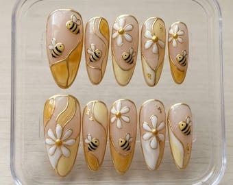 Unghie finte Bumble Bee Daisy, gel 3D color mandorla con design floreale estivo