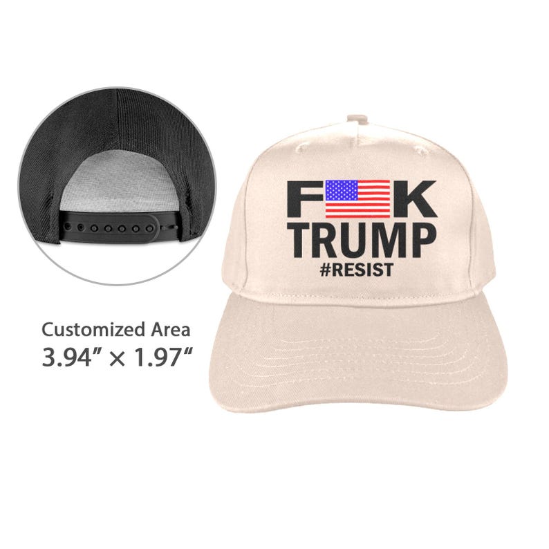 May include: A beige baseball cap with the text "F*K TRUMP" in black, with an American flag graphic and the word "#RESIST" below. The cap has a black adjustable snapback closure.