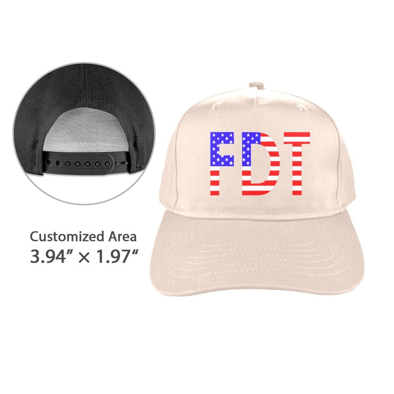 May include: A beige baseball cap with the letters "FDT" in red, white, and blue. The letters are designed to resemble the American flag. The cap has a black adjustable snapback closure.
