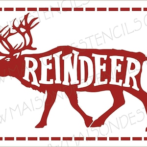 May include: A red reindeer silhouette stencil with the word "REINDEER" in white. The stencil is framed with a dashed border and the website address "MAISONDESSTENCILS.COM" is visible.