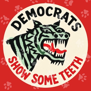 May include: A circular sticker with a red background featuring a pattern of light red paw prints. In the center, a light green tiger head with black stripes and an open mouth showing sharp teeth and a red tongue. Text reads DEMOCRATS SHOW SOME TEETH.