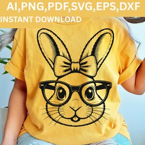 May include: Yellow t-shirt featuring a black and white illustration of a bunny wearing glasses and a bow tie. The text "AI, PNG, PDF, SVG, EPS, DXF" and "INSTANT DOWNLOAD" are printed at the top.