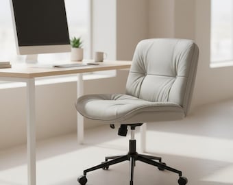 Silla de oficina con patas cruzadas de cuero sintético: giratoria, regulable en altura, con asiento ancho y ruedas.