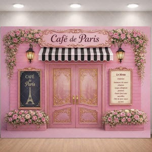May include: A pink Parisian cafe backdrop with the words "Café de Paris" above a black and white striped awning. The scene includes a menu board and is decorated with floral arrangements and lanterns, creating a charming aesthetic.