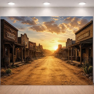 May include: A large canvas print depicting a Western town at sunset. The image shows a dusty road lined with wooden buildings, including a saloon and general store. The sky is filled with clouds and the sun is setting in the distance, casting a warm glow.