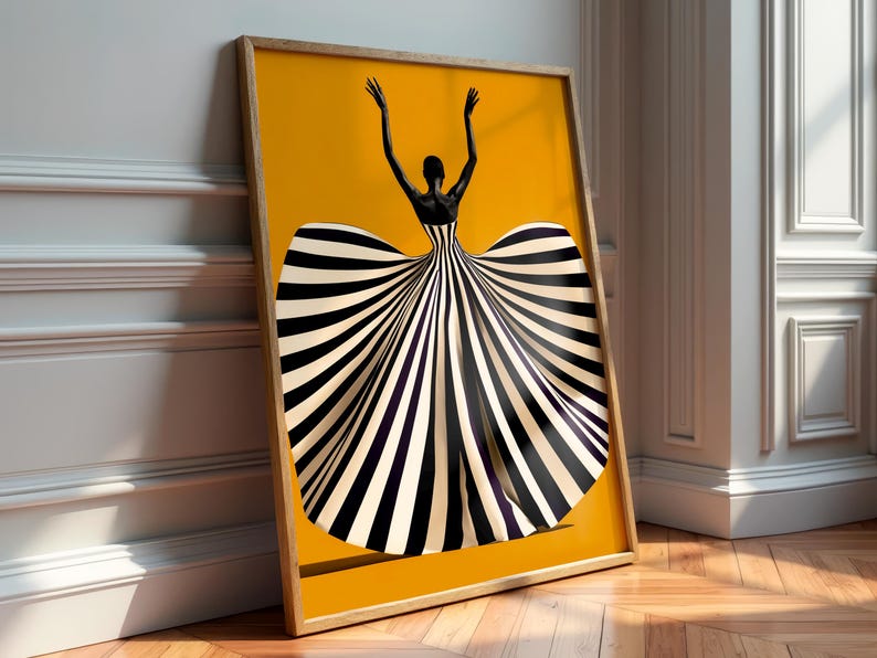 May include: A framed vertical wall art print featuring a silhouette of a person with arms raised, wearing a voluminous gown with bold black and white vertical stripes against a solid, vibrant mustard yellow background.