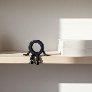 Articulated Tire Man Figurine, Matte Black Automotive Desk Toy, Movable Shelf Accessory