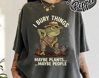 Camiseta engraçada "Sapo Jardineiro: Eu Enterro Coisas, Talvez Plantas, Talvez Pessoas"