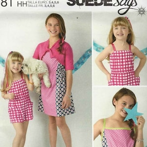 May include: A sewing pattern for girls' dresses. The pattern includes three different styles: "Cool", "Girly", and "Preppy". The pattern is for sizes 3, 4, 5, and 6. The pattern is designed and printed in the USA.