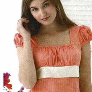 May include: Simplicity sewing pattern featuring six easy-to-make tops. The image shows a woman wearing a peach-colored top with a square neckline and white band. The pattern includes various top designs with different sleeve styles and floral prints.