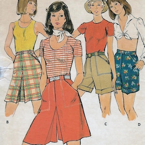 May include: Vintage Butterick sewing pattern 3739 featuring illustrations of women's shorts and tops. The pattern includes a variety of styles, including plaid shorts, a red top, and floral shorts. Size 28 is indicated on the pattern.