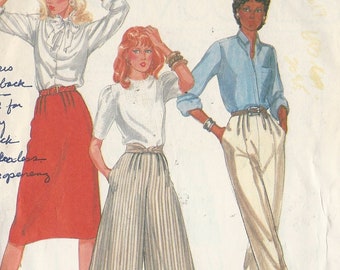 McCalls 7856 Ladies culottes pants skirt front pleats back gathered to fixed waist side button opening Size 14 uncut sewing pattern