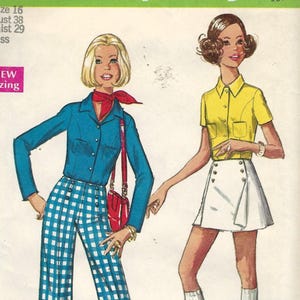 May include: Simplicity pattern 8759 shows two illustrated outfits. One woman wears a blue shirt, checkered trousers, and red accessories. The other wears a yellow shirt and white skirt. The pattern includes sizing information.