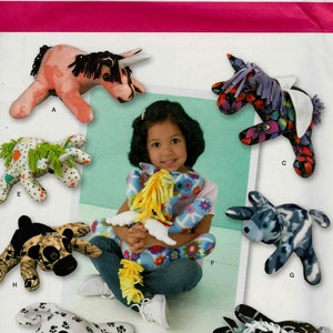 May include: Simplicity pattern 1930 showcases several soft toy designs, such as a bull, horse, donkey, and cow. The toys are crafted from fabric in diverse patterns and colours. The pattern is one size and includes the text "Sonja's Snuggables".