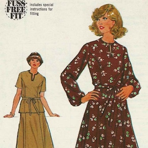 May include: Simplicity sewing pattern number 8666 for a dress with a floral print. The pattern includes instructions for a "fuss free fit" and is for a bust size of 94 cm (37 inches).