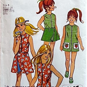 May include: Vintage sewing pattern illustration featuring four girls in colorful dresses. The dresses include a red and white mushroom print, a green and white checkered pattern, and a green skirt. The text on the image indicates size 8, a 27-inch bust, and a 23.5-inch waist.