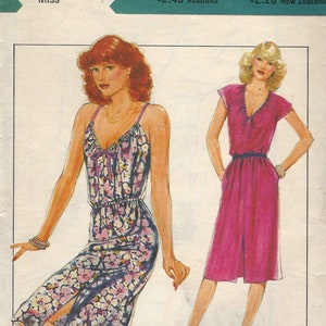 May include: A vintage sewing pattern for two dresses. The pattern is for size 10, bust 83 cm. The first dress is a floral print with a slit up the side. The second dress is a solid pink with a V-neck and short sleeves. The pattern is titled "Style" and is priced at $2.40 in Australia and $2.20 in New Zealand.