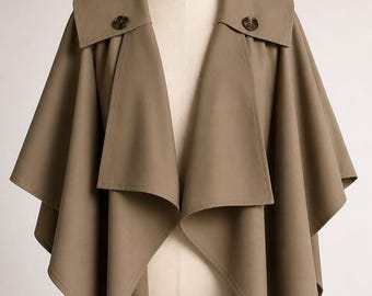 Beżowy, minimalistyczny płaszcz-peleryna, damska kurtka w stylu poncho, zapięcie na guziki, nowoczesna odzież wierzchnia
