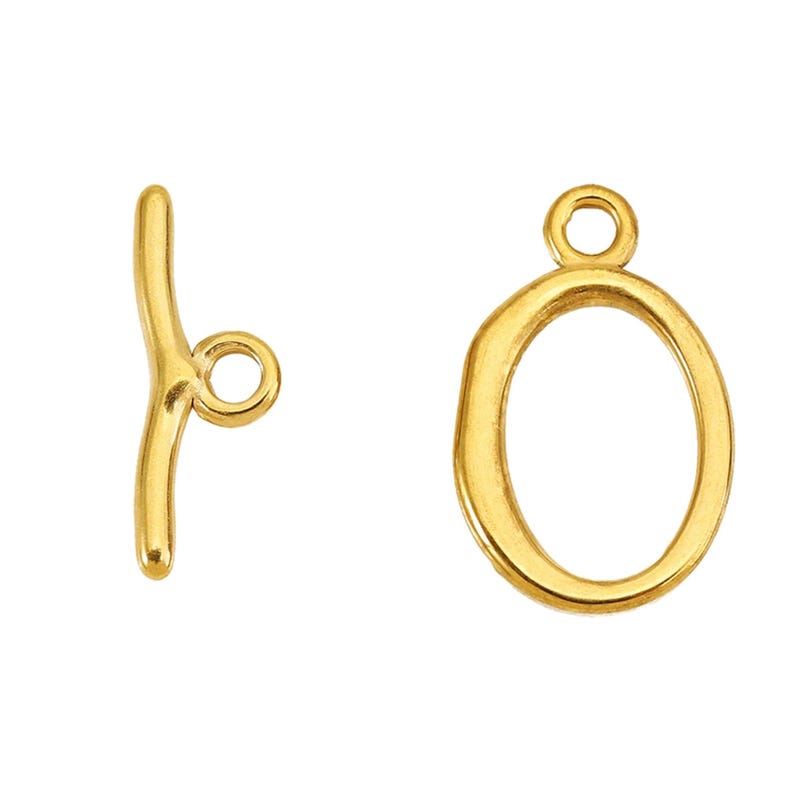 Original supplier Gold-F sample set: smaller oval ring and short curved T-bar.