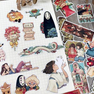 May include: A collection of colorful anime-style stickers featuring characters and scenes. Includes a dragon, a frog, a faceless spirit, and other figures. The stickers are on a white grid background.