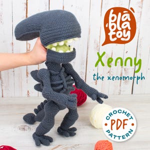 May include: A handmade, dark gray crochet xenomorph doll with a large head, open mouth, and spiky back. The doll has articulated arms and legs. The image includes the text "Bla Toy" and "Xenny the xenomorph". A "Crochet PDF Pattern" logo is also visible.