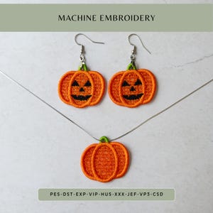 May include: A set of machine embroidery pumpkin jewelry including two earrings and one necklace pendant. The orange pumpkins feature green stems and black stitched jack-o'-lantern faces. The text reads MACHINE EMBROIDERY and PES-DST-EXP-VIP-HUS-XXX-JEF-VP3-CSD.