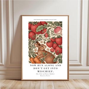 May include: A framed art print featuring a brown rabbit surrounded by red strawberries, green leaves, and orange carrots. The text reads THE WOODLAND STORIES COLLECTION, NOW RUN ALONG AND DON'T GET INTO MISCHIEF, The Tale of Peter Rabbit, Beatrix Potter.