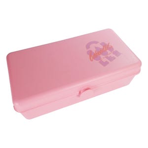 May include: A rectangular, light pink plastic box with a snap closure. The box has the text "Caboodles" in a stylized font on the top. The box is designed for storing small items, such as cosmetics or craft supplies.