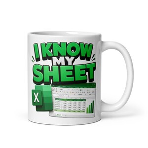 May include: A white ceramic mug featuring the green text I KNOW MY SHEET in a bold, blocky font. Below the text is a graphic of a green spreadsheet icon and a digital spreadsheet interface displaying a sales report with various data columns.