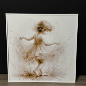 May include: A sepia-toned framed print of a young girl dancing. The girl is wearing a flowing dress and has her arms outstretched. The artwork is in a white frame and set against a dark background.