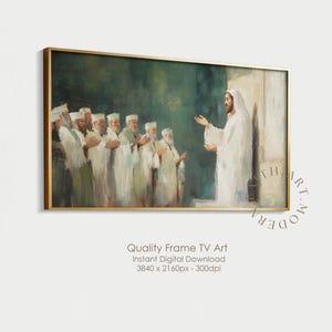 Puede incluir: Una impresión artística digital enmarcada representa una escena religiosa con figuras vestidas con túnicas blancas. La obra presenta una figura central con los brazos extendidos, rodeada por un grupo de personas. El marco es dorado y el fondo es una mezcla de verde y blanco.