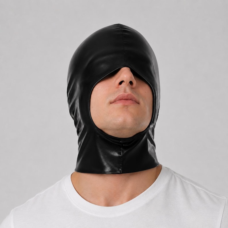 May include: A black hood made of a smooth, synthetic material with a glossy finish. The hood features a single large, rounded opening that exposes the nose, mouth, and chin area, covering the top of the head and the neck completely.