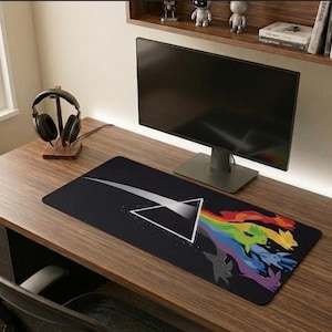 May include: A set of three ceramic mugs with a speckled, matte finish. The mugs are in shades of cream, light gray, and dark gray. Each mug has a simple, minimalist design and a rounded handle.