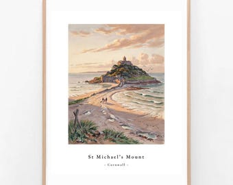 May include: A framed art print featuring a painting of St. Michael's Mount in Cornwall, showing a castle on a tidal island connected by a stone causeway to a sandy beach at sunset, with the text St. Michael's Mount - Cornwall - printed below.